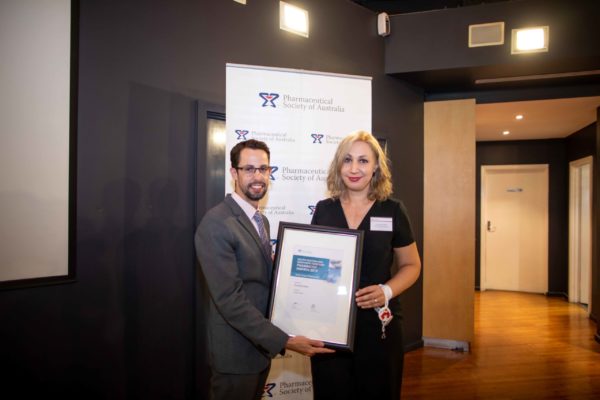 Dr Chris Freeman presents Veronika Seda with the SA:NT Early Career Pharmacist Development Award