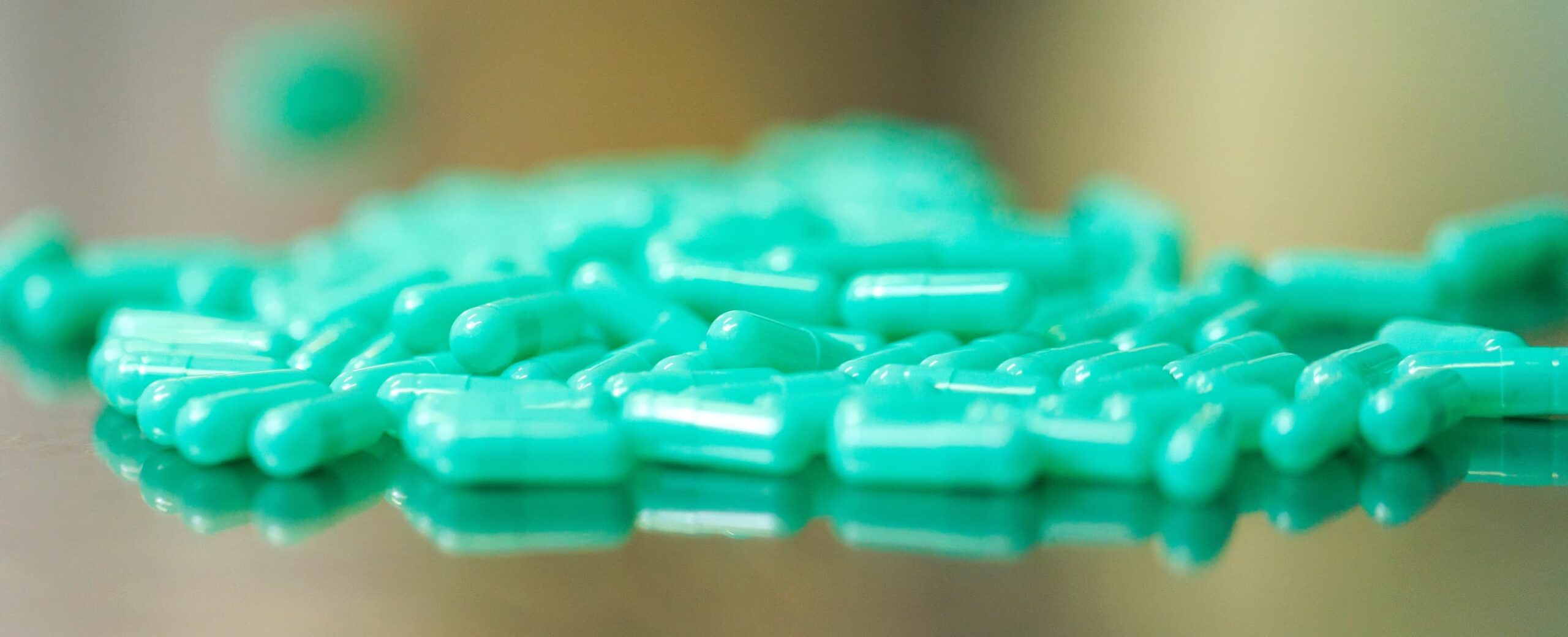 image of a pile of green pills