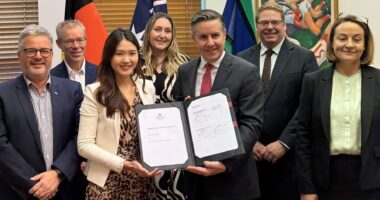 Strategic Pharmacy Agreement signing Image of PSA team with Health minister with signed document