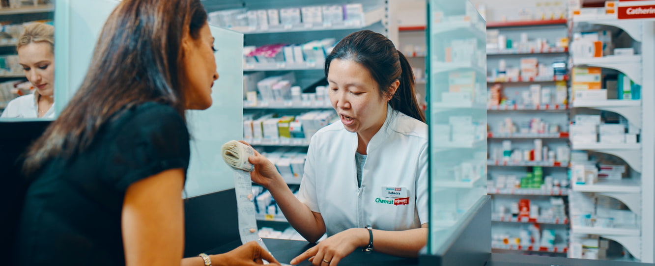 Pharmacist talking to patient